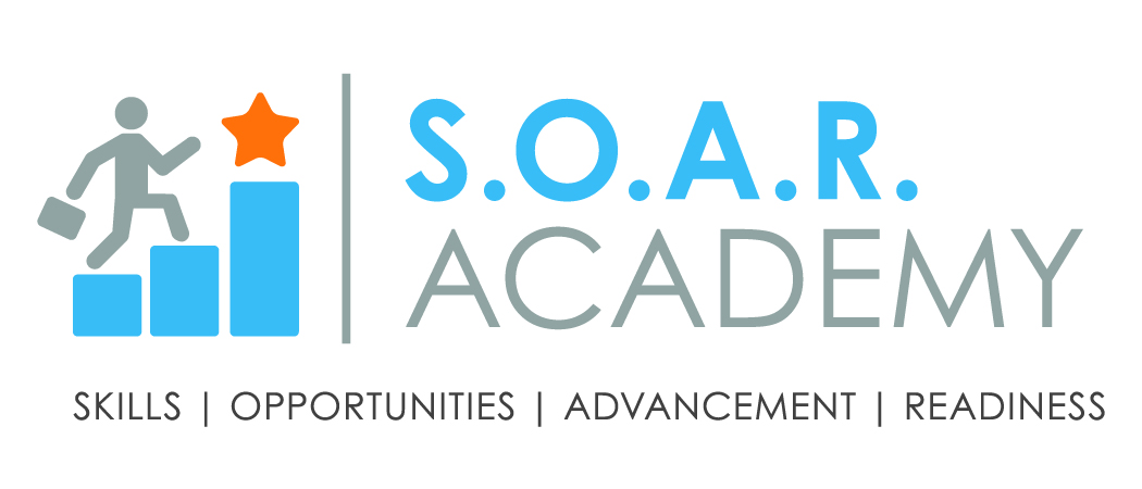 CLC SOAR (dots) Academy logo hires_color Two volunteers in a school hallway stack boxes labeled Student Supply Kit while a backdrop with a mountain scene is being set up.